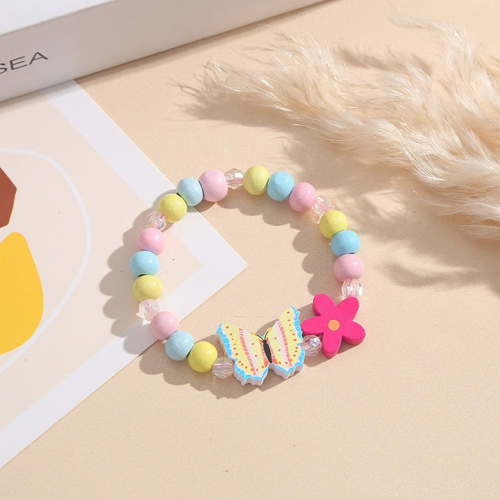 Adorable pink wooden bead charm bracelet with butterfly & heart, girls' & women's playful jewelry.