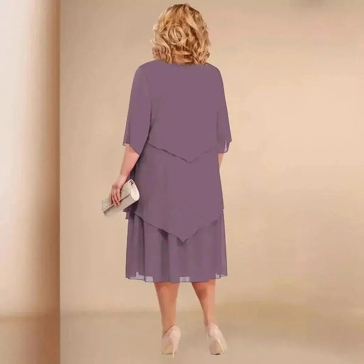 Fashionable plus size women's asymmetrical layered midi dress, suitable for special occasions and elegant parties.
