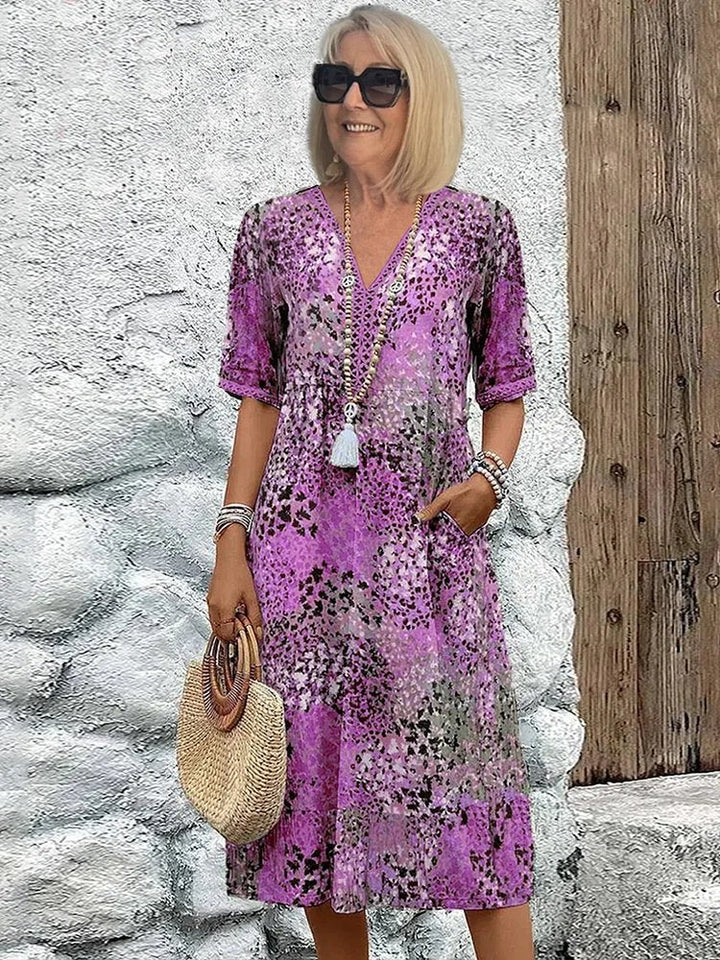 Versatile plus size floral V-neck midi dress with pockets, elegant and comfortable for any woman's summer wardrobe.