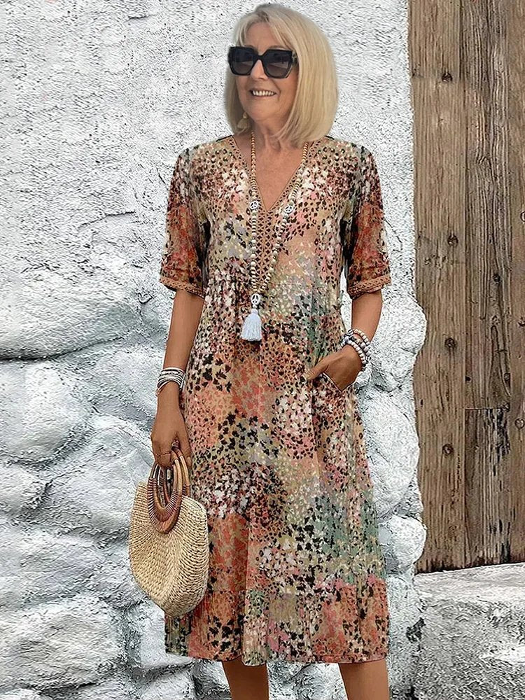 Stylish plus size women's V-neck floral midi dress with handy pockets, perfect for casual summer days.