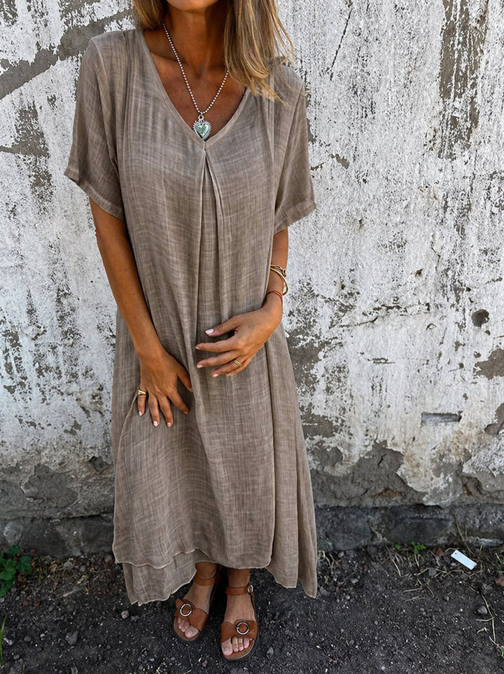 Plus size V-neck maxi dress with short sleeves, loose fit. Comfortable casual summer style for women.