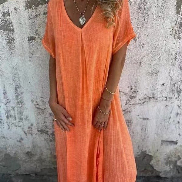 Elegant plus size V-neck maxi dress with short sleeves. Loose fit design for comfortable, stylish casual wear.