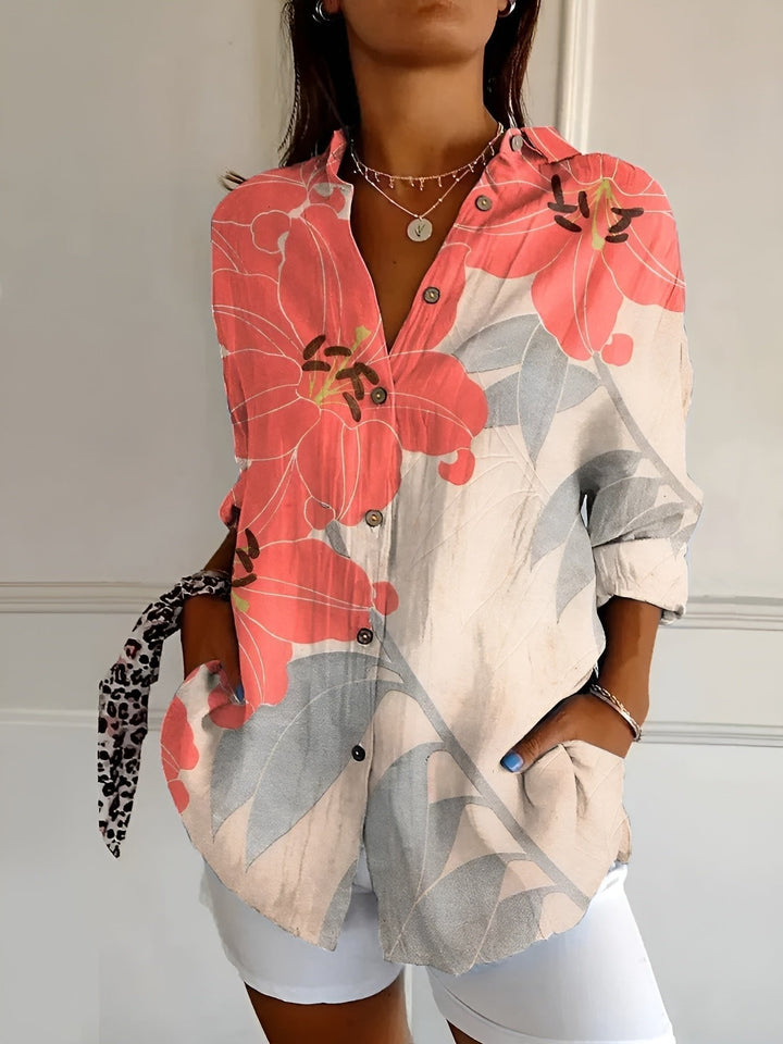 Side view of a women's plus size blue floral print long sleeve button-up shirt, a versatile top.
