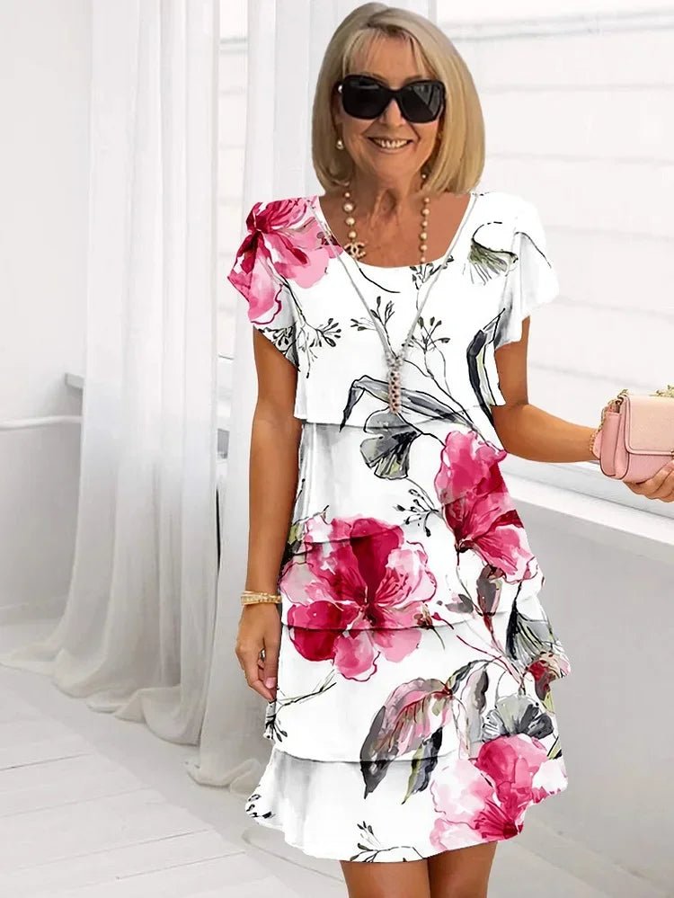 Plus size women's floral print midi dress with ruffled short sleeves, perfect for elegant summer occasions.
