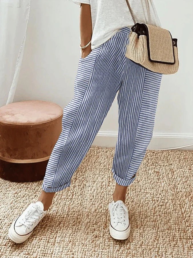Plus size women's striped trousers with elastic waist, relaxed fit for comfortable casual wear.