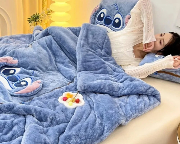 Close-up of soft plush blanket texture with a matching cushion, highlighting cuddly warmth & cozy home comfort.
