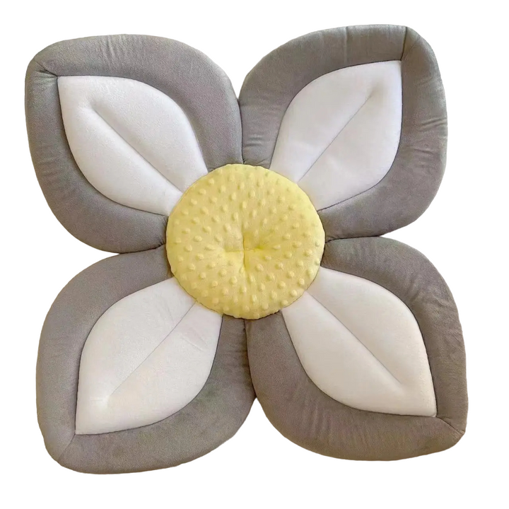 Plush blooming flower baby bath seat for infant sink bathtime. Soft, supportive & machine washable.