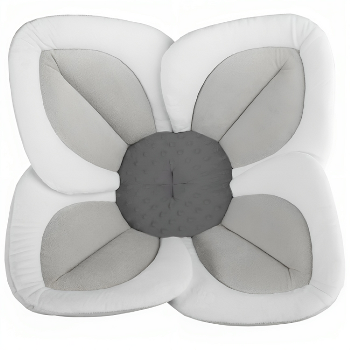 Unique blooming flower baby bath support. Ideal baby shower gift, machine washable & travel-friendly.