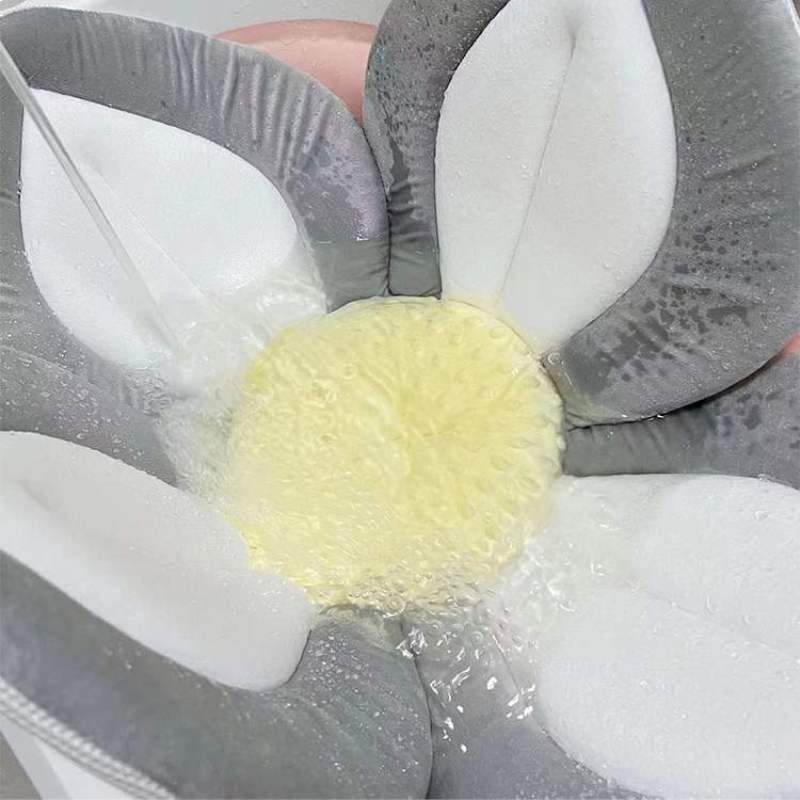 Plush blooming flower infant bath seat. Perfect for safe & comfortable newborn sink or tub bathtime support.