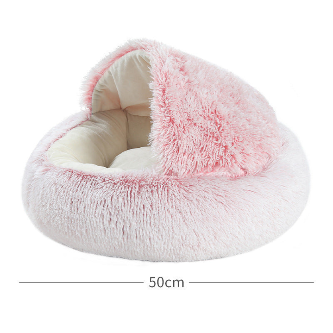Soft plush hooded cat bed offers a warm, cozy sanctuary for your pet. Ideal cuddle cave.