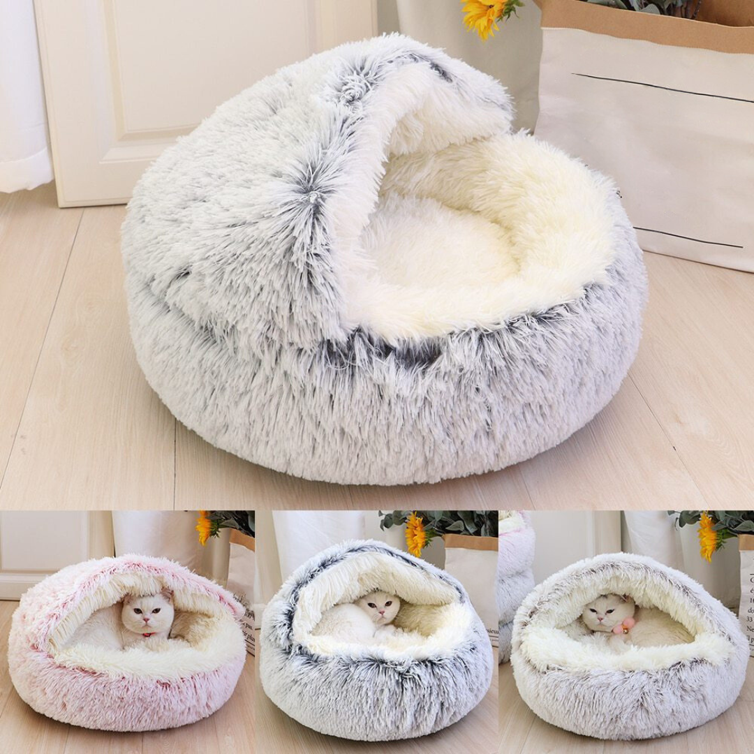 Pet comfort with this hooded plush cat bed, a cozy machine washable cuddle cave for your feline friend.