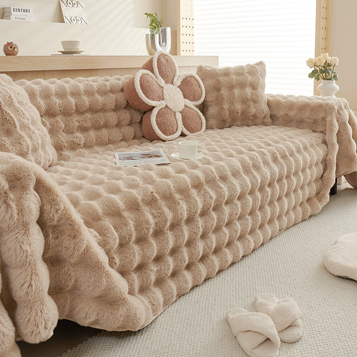 Plush cream white faux fur sofa protector, non-slip, stylish furniture cover for comfort & decor.
