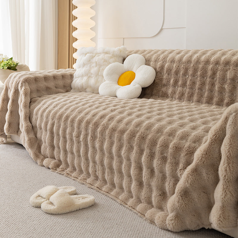 Modern khaki non-slip sofa cover, faux fur plush design, cozy living room decor & protection.