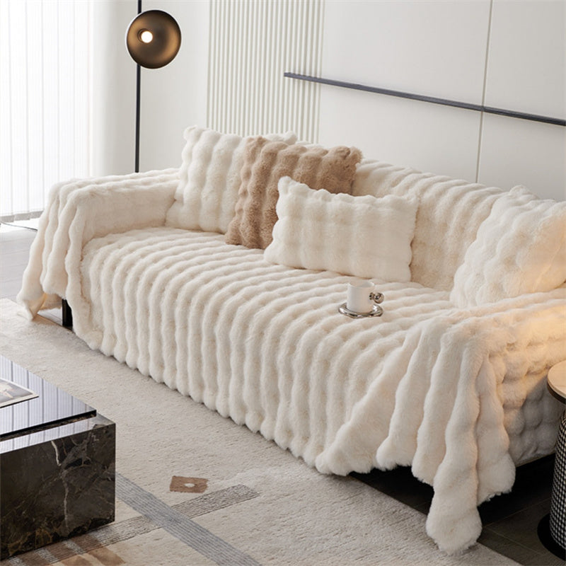 Khaki non-slip faux fur sofa cover, pet-friendly furniture protector & cozy decorative throw.