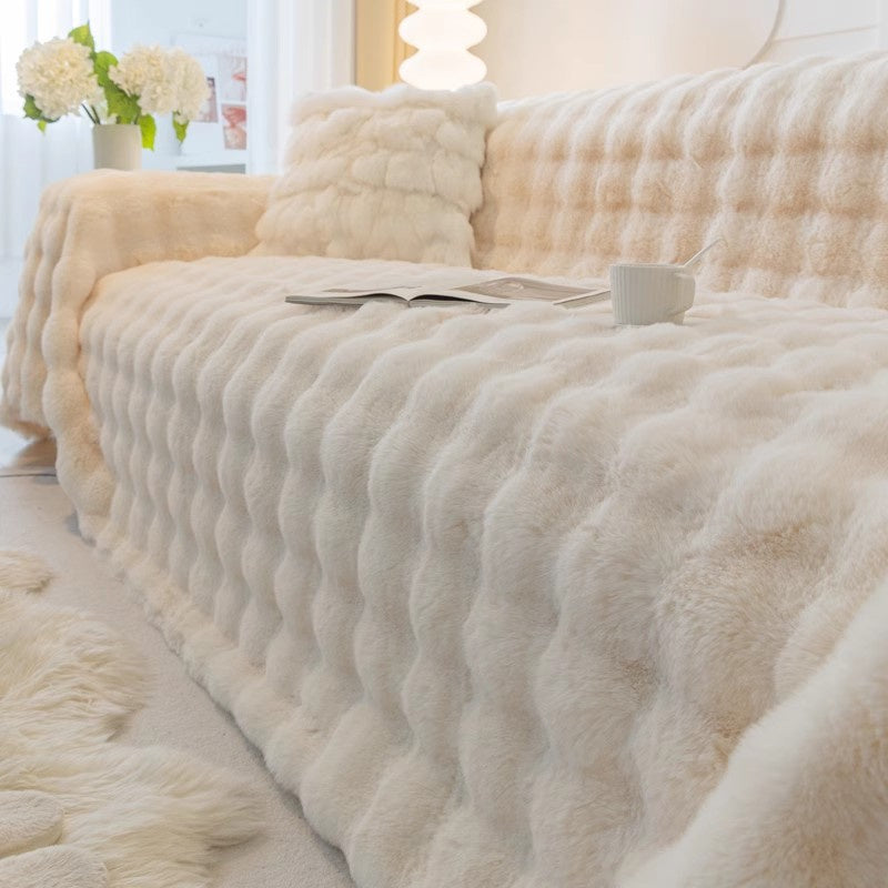 Dark gray elegant faux fur sofa cover, non-slip, adds plush comfort & stylish living room decor.