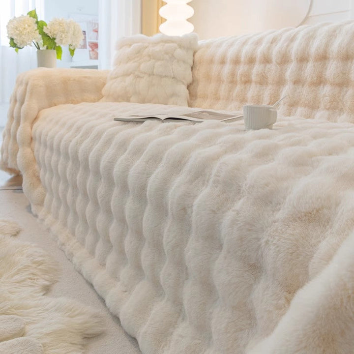 Dark gray elegant faux fur sofa cover, non-slip, adds plush comfort & stylish living room decor.