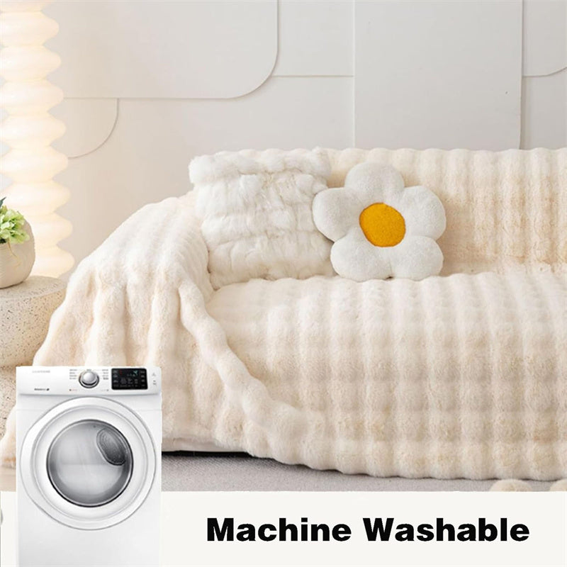 Cream white plush faux fur couch cover, non-slip, elegant and pet-friendly living room accent.