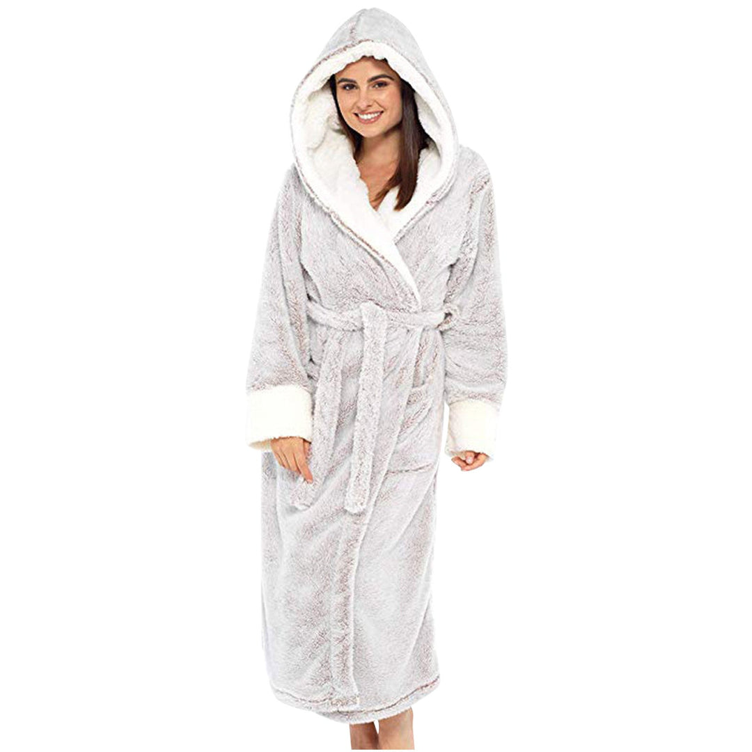 Woman enjoying ultimate comfort in a luxurious plush hooded robe with a secure belt. Cozy loungewear.