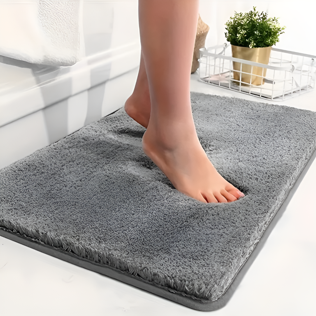 Soft, absorbent microfiber bath mat with non-slip backing, ideal for luxury bathroom decor.