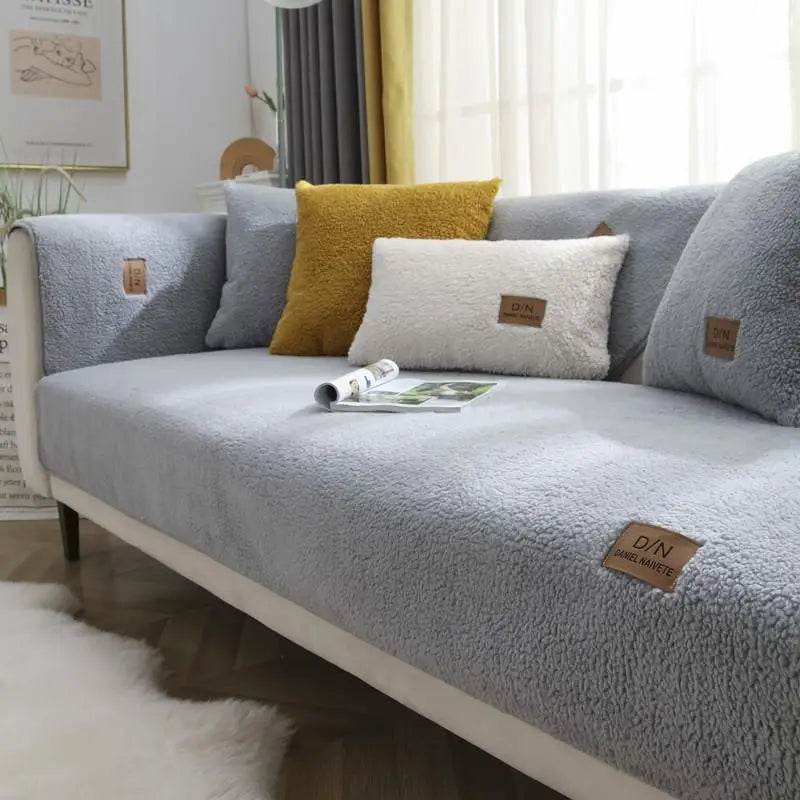Waterproof Sherpa fleece sofa cover provides plush comfort & pet-friendly protection for your living room furniture.