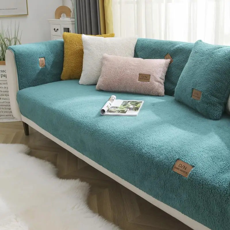 Enjoy plush comfort with this non-slip Sherpa fleece sofa cover. Waterproof design protects furniture from spills & pets.