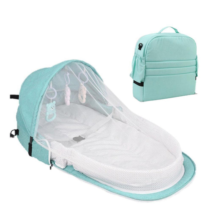 Newborn travel crib with pop-up mosquito net, ensuring peaceful sleep and insect protection.