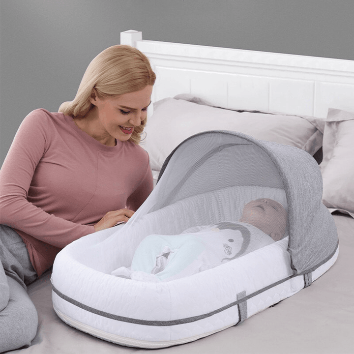 Secure infant tent bed with a fine mosquito net, providing essential insect protection for newborns.