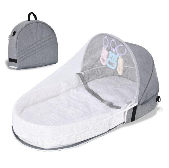 Easy-to-fold portable crib with mosquito net, a safe and practical travel solution for babies.