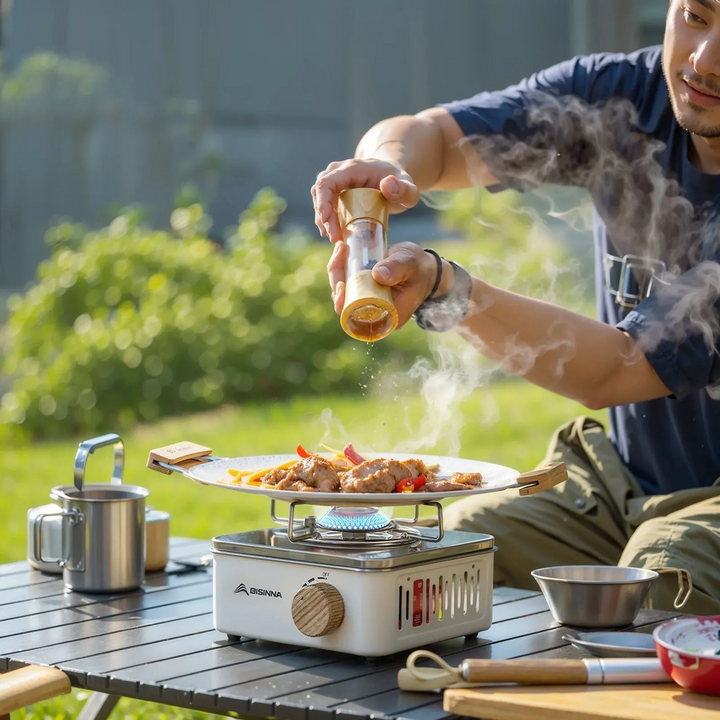 Portable camping gas stove with 2800W power for outdoor cooking and backpacking.