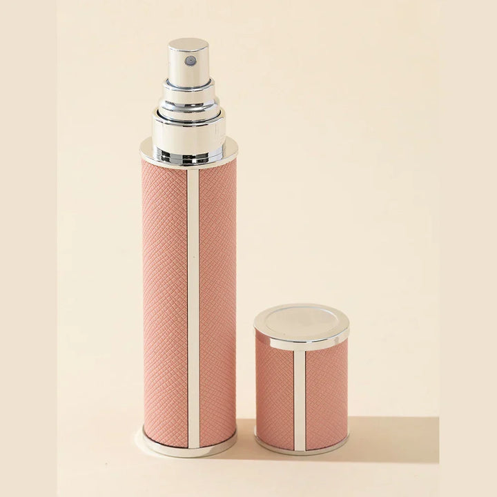 Stylish, colorful 0.34 fl oz mini perfume travel spray bottle. Portable, refillable, leak-proof fragrance atomizer.
