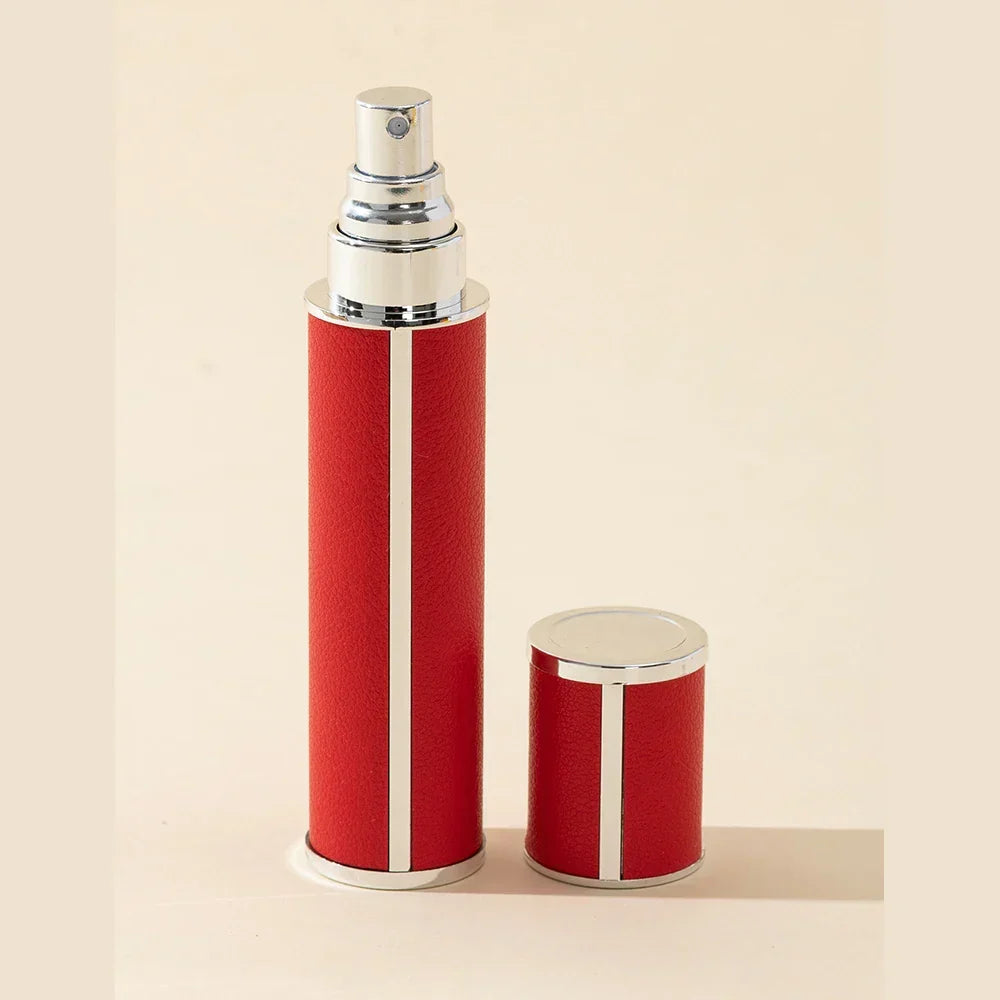 Sleek black unisex perfume travel spray atomizer, 0.34 fl oz. Refillable, portable personal care accessory.