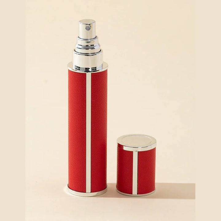 Sleek black unisex perfume travel spray atomizer, 0.34 fl oz. Refillable, portable personal care accessory.