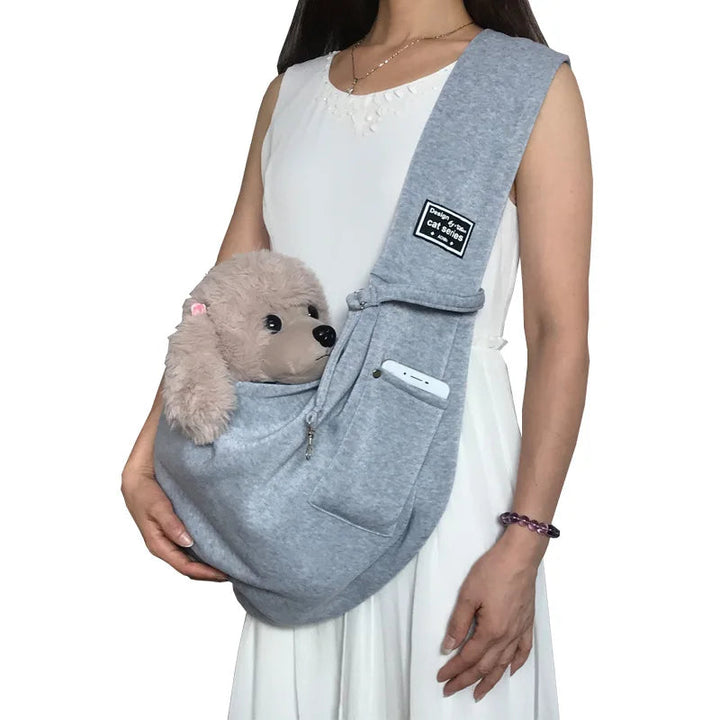 Durable oxford fabric pet carrier, perfect for small dog travel & cat comfort. A safe portable pet accessory.