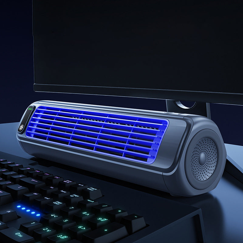 Grey portable desk fan, cordless and rechargeable, for personal office and home cooling.