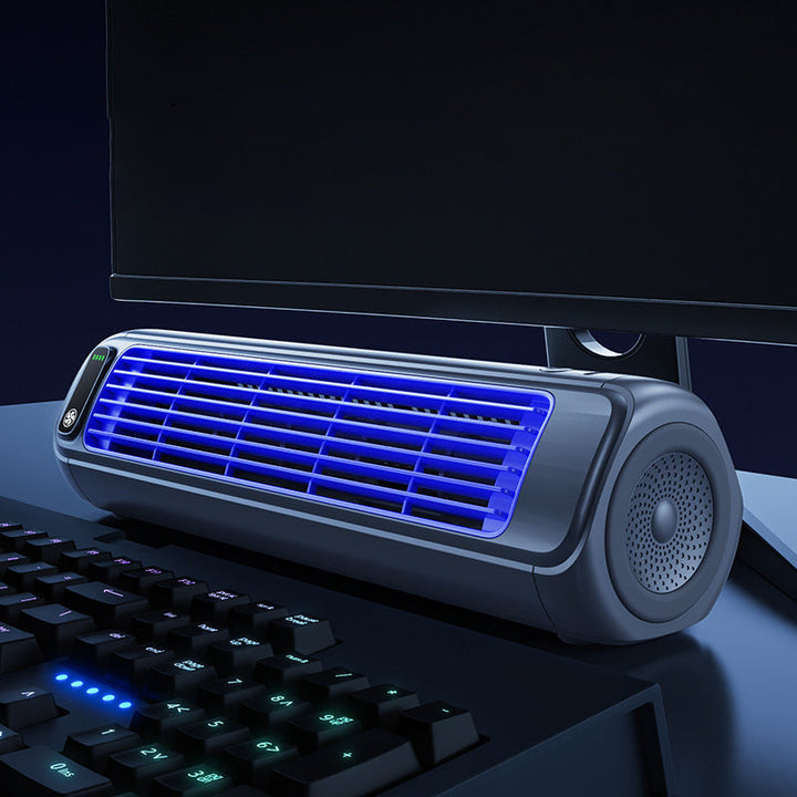 Grey portable desk fan, cordless and rechargeable, for personal office and home cooling.