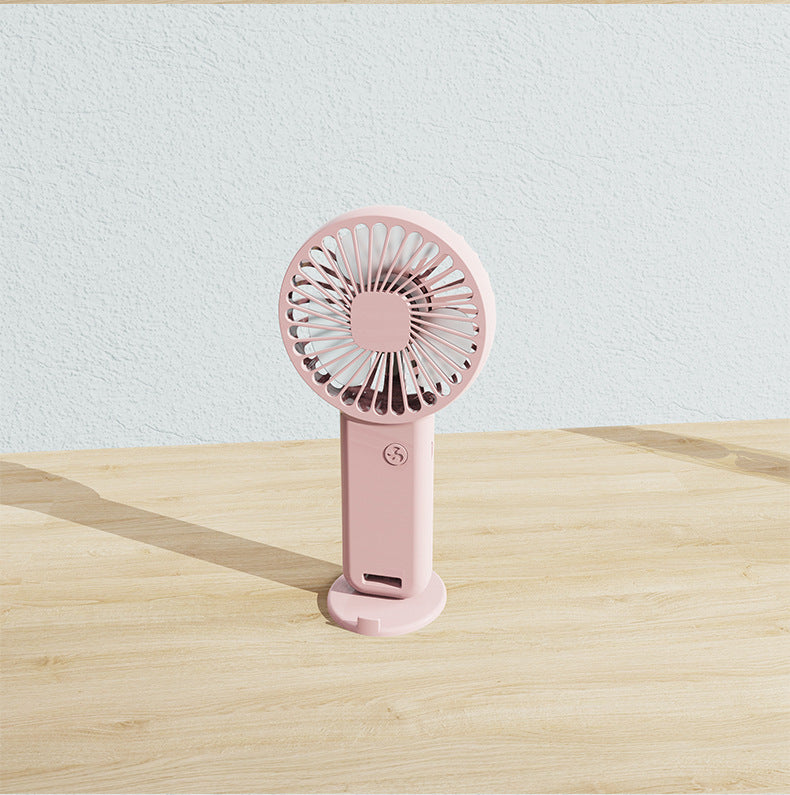 Handheld rechargeable personal fan, compact for easy portability, provides instant cooling anywhere you go.