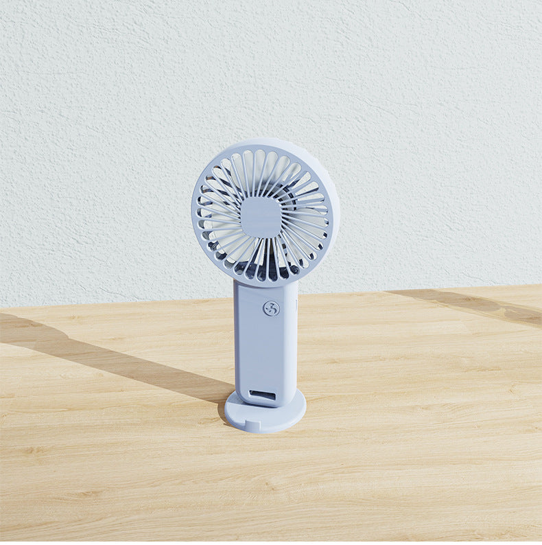 Easy-to-carry rechargeable mini fan for personal cooling. Ideal for travel, desk, or outdoor adventures.