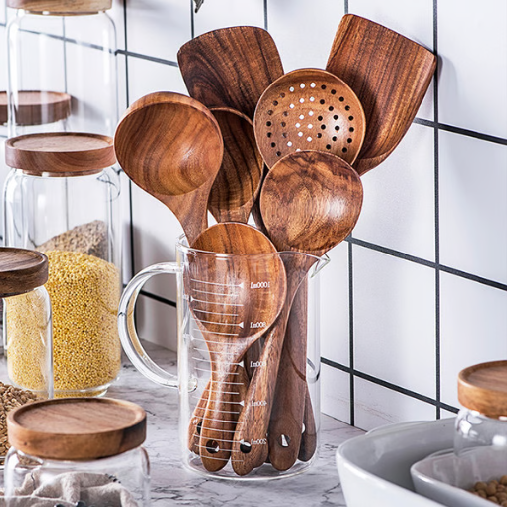 Premium 7-piece natural teak wood kitchen utensil set. Durable, eco-friendly wooden spoons & spatulas for cooking & serving.