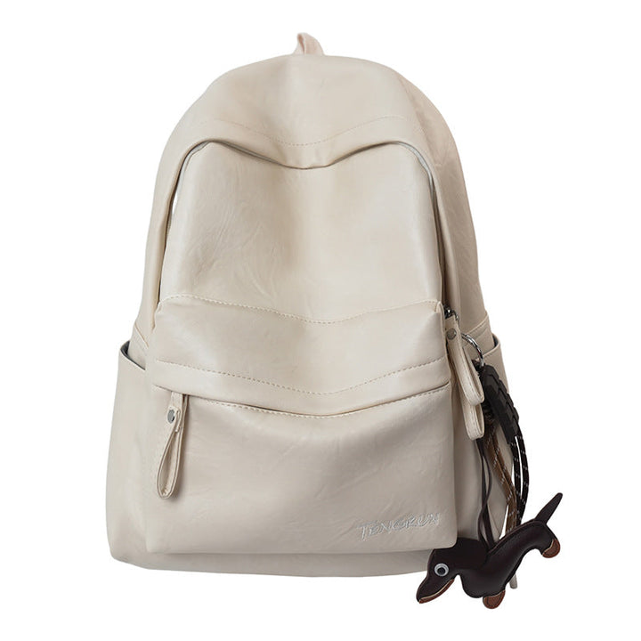 Versatile black leather work backpack with multiple exterior pockets for easy access to daily travel and work items.