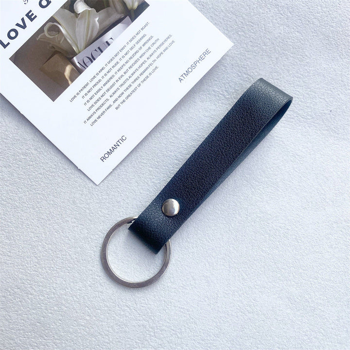 Orange leather key fob, a vibrant & stylish key organizer.