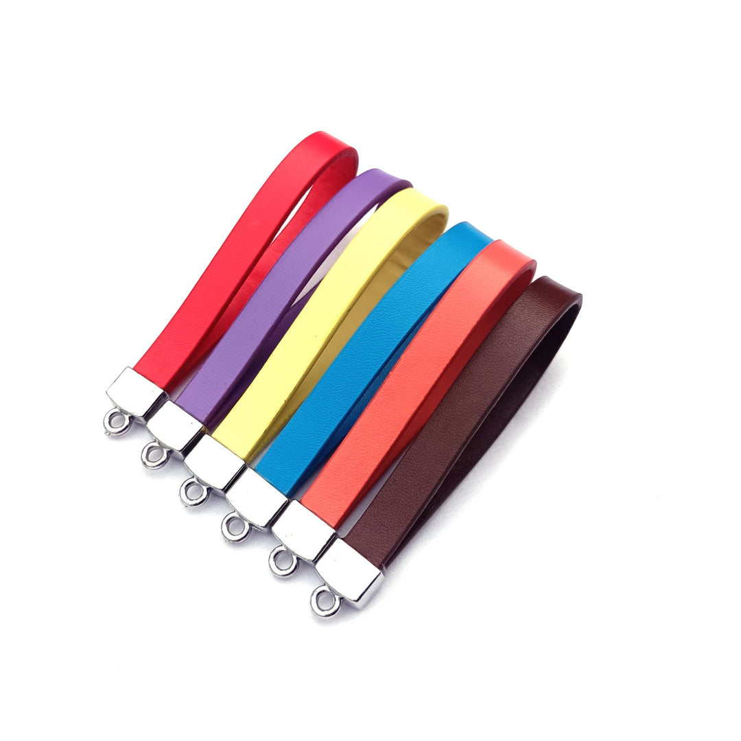 Premium brown leather key fob with sturdy metal ring, ideal for organizing keys. Durable unisex accessory.