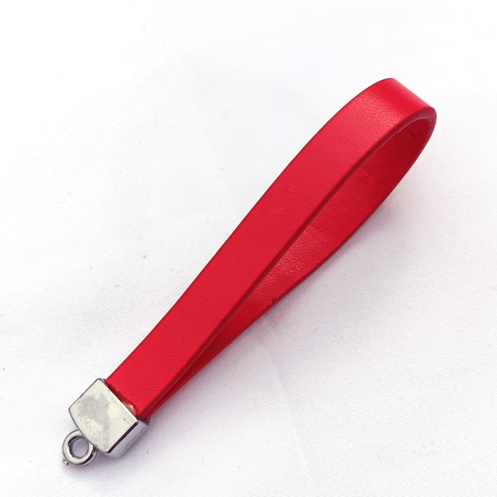 Sleek gray leather key fob with polished hardware, a stylish and practical key organizer for everyday use.