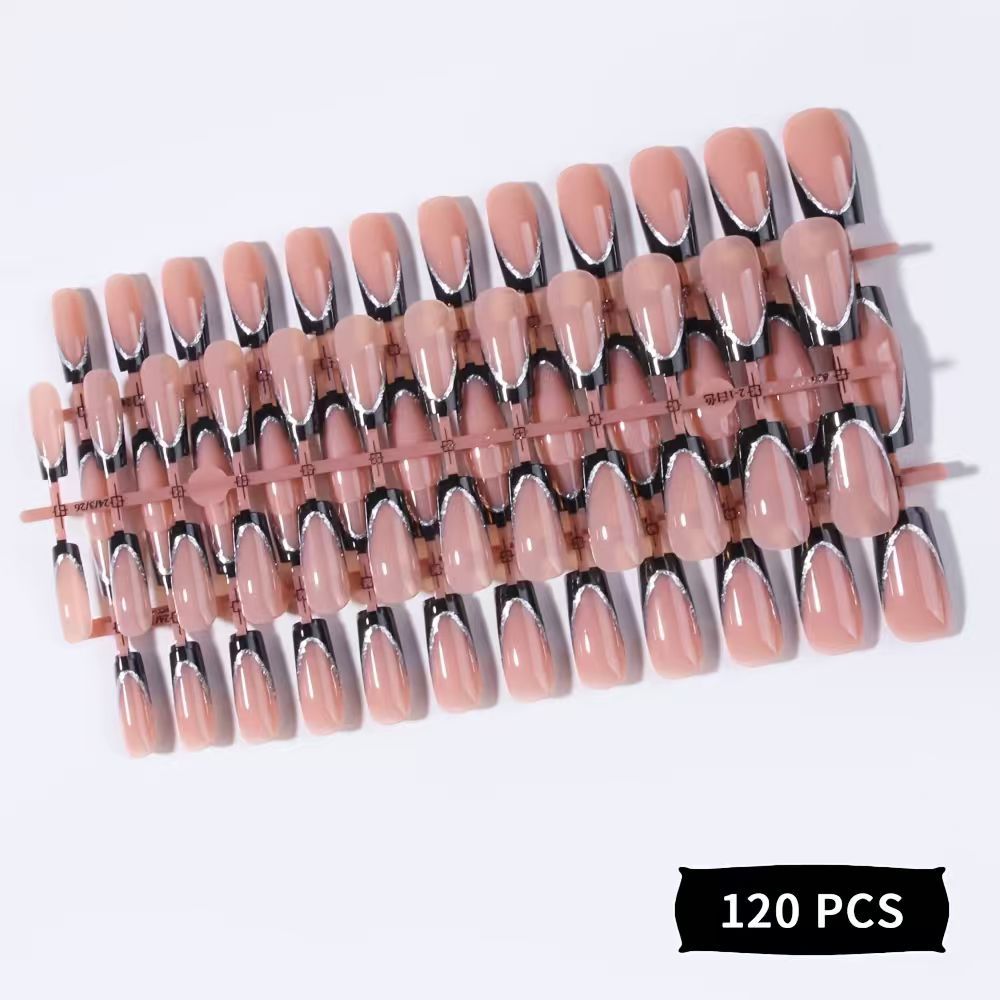 Stylish black glossy press-on nails for women. Achieve trendy nail art with these easy fake nails.
