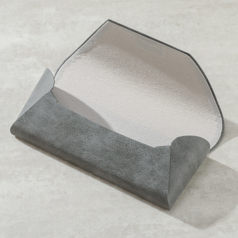 Durable leather glasses pouch offers robust protection for sunglasses & spectacles.