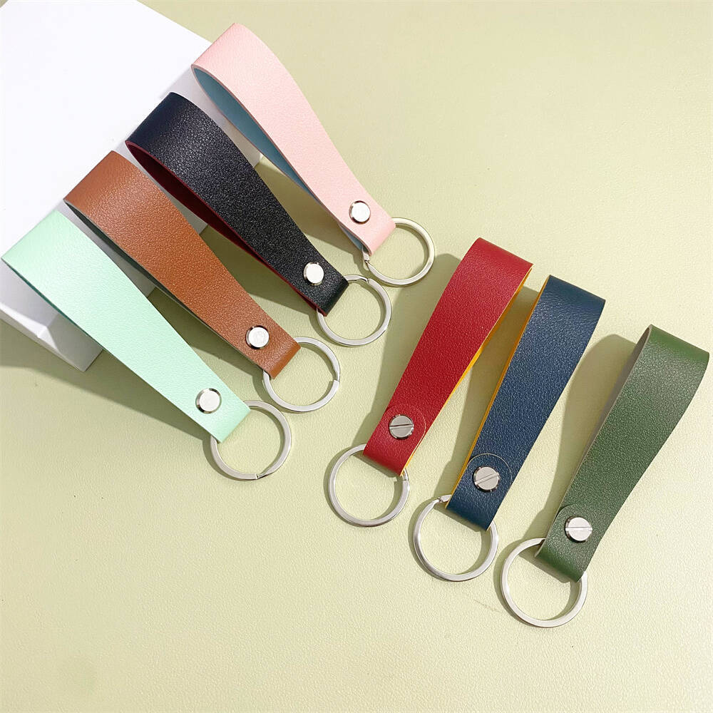 Premium leather key fob holder, sleek unisex accessory for everyday carry.