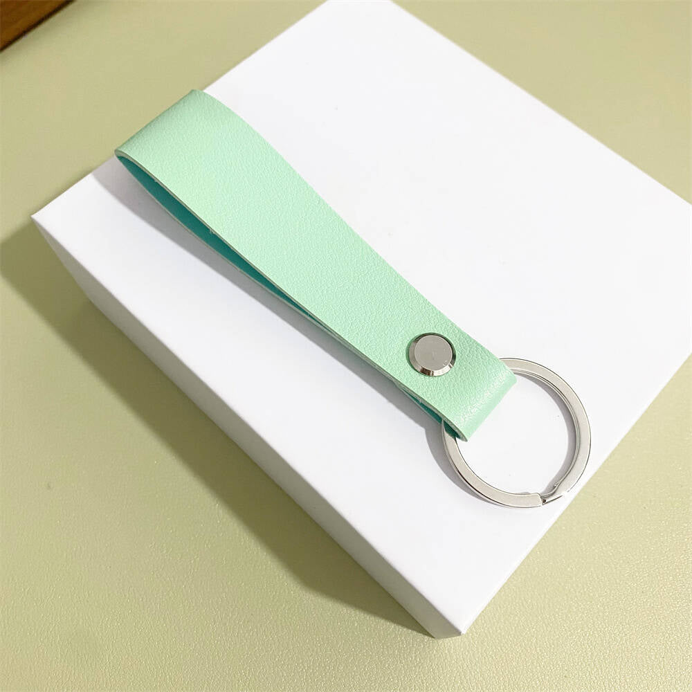 Genuine leather key protector, sleek design for secure keyfob storage.