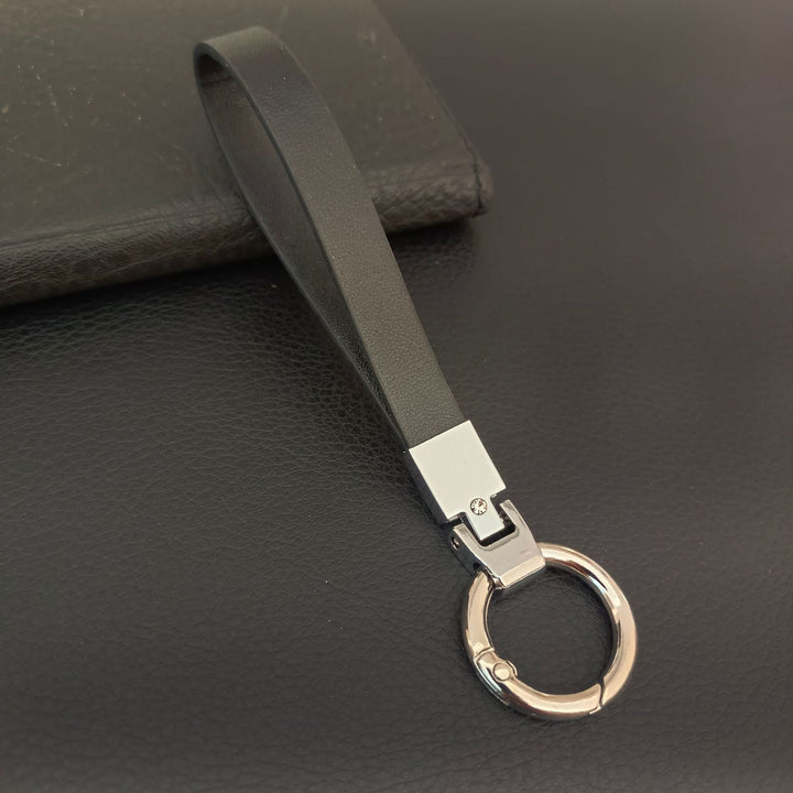 Sleek black leather key holder, a premium daily carry accessory for modern key organization.