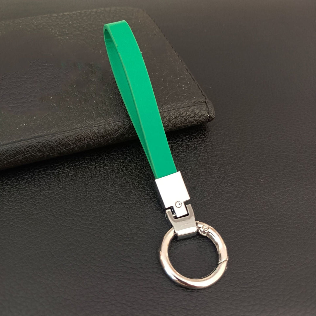 Textured genuine leather key holder with secure snap closure for premium key organization.