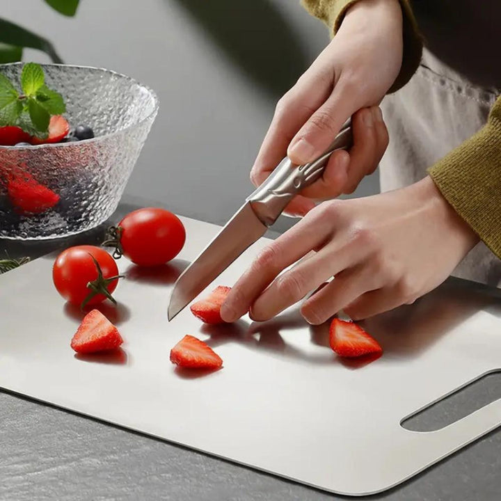 Non-slip stainless steel cutting board ensures secure and hygienic food preparation in modern kitchens.
