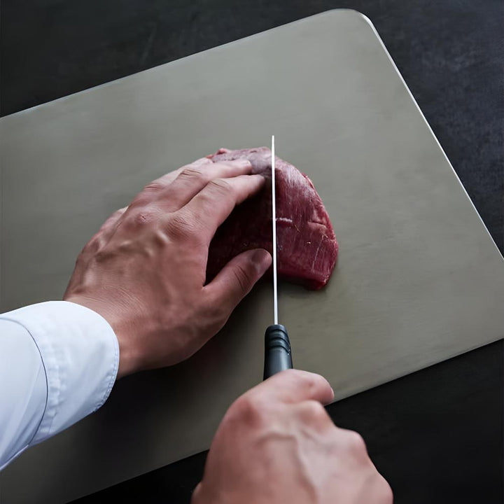 Sleek silver stainless steel cutting board, a durable and hygienic addition to any professional kitchen.